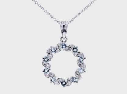 Circle Pendant with 10 Aquamarine and 20 White Topaz Stones in Rhodium Plated .925 Sterling Silver